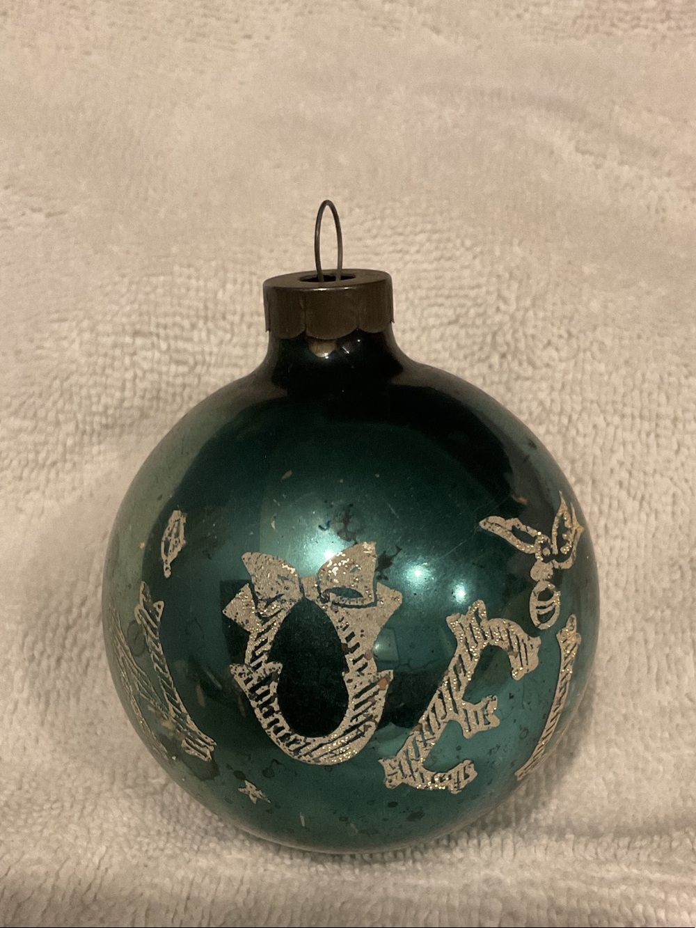 Shiny Teal Glass Holiday Ball Ornament with Silver Motif